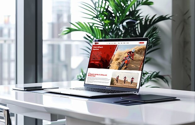 Motozone motocross website design displayed on a laptop showcasing responsive web development by Prism Digital UAE
