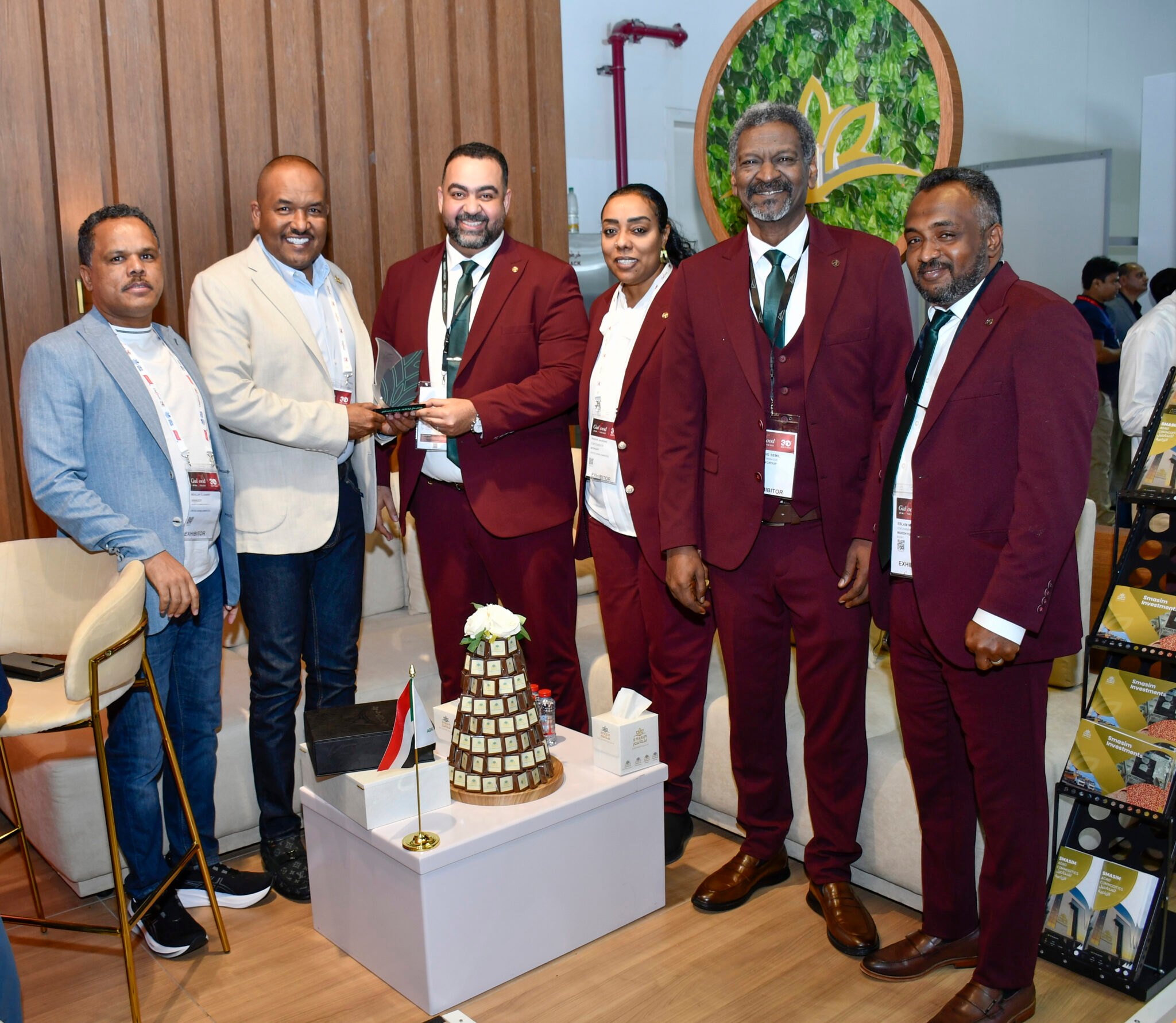 Smasim team members at an exhibition – professional business group photo.